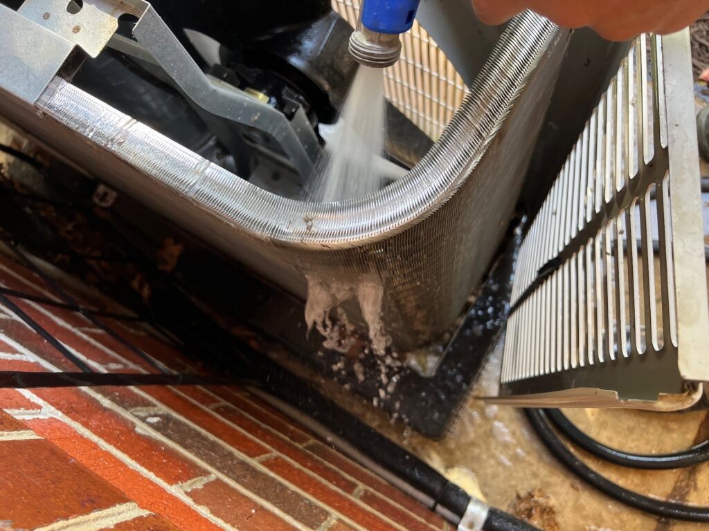 Photo of half dirty and half clean heat pump